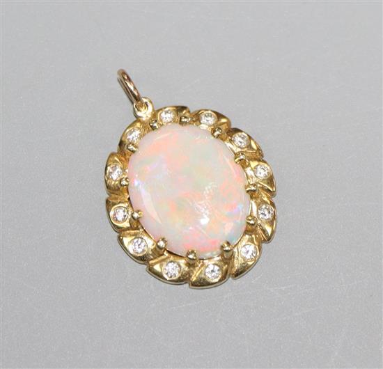 A modern yellow metal, white opal and diamond cluster set oval pendant, 2cm.